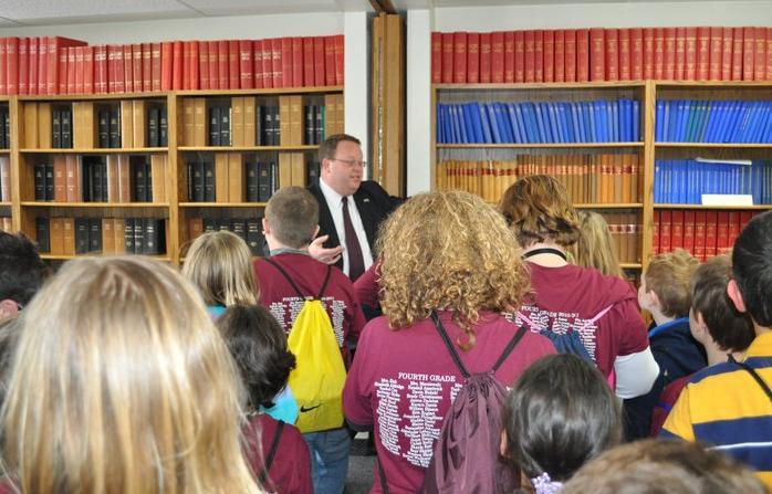 Sec. State Jason Gant shows Madison 4th graders his library in the Capitol, Pierre, SD