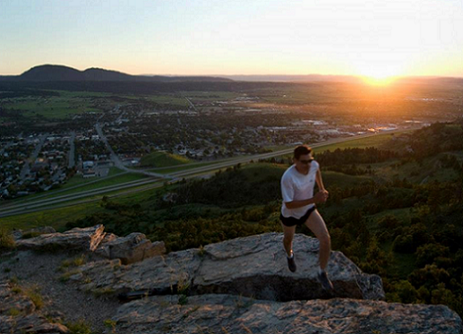 Runner at sunset, Lookout Mountain, overlooking Spearfish, South Dakota. Photo credit: D.C. Booth Fish Hatchery, May 10, 2013.