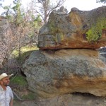Mark Hollenbeck shows me Alligator Rock, a prominent feature of the canyon that cuts through his Edgemont ranch. Somewhere behind us, Powertech CEO Dick Clement and lobbyist Larry Mann contemplate leaving me in the canyon for the coyotes. (CAH, 2014.08.17)