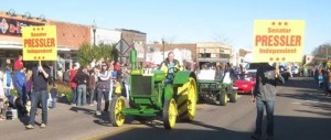 Pressler drives down the middle... of Main Street, on his 1929 D John Deere, in the Hobo Day parade, Brookings, South Dakota, October 25, 2014.